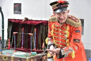 Uncle Tacko working his flea circus at Liverpool' 'Physical Fest'
